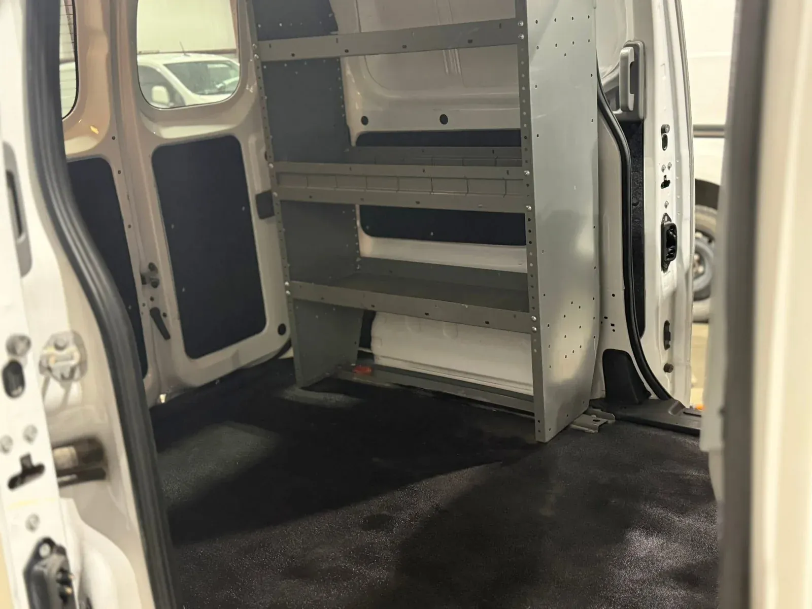 Work van cargo area and shelving after a fleet interior cleaning
